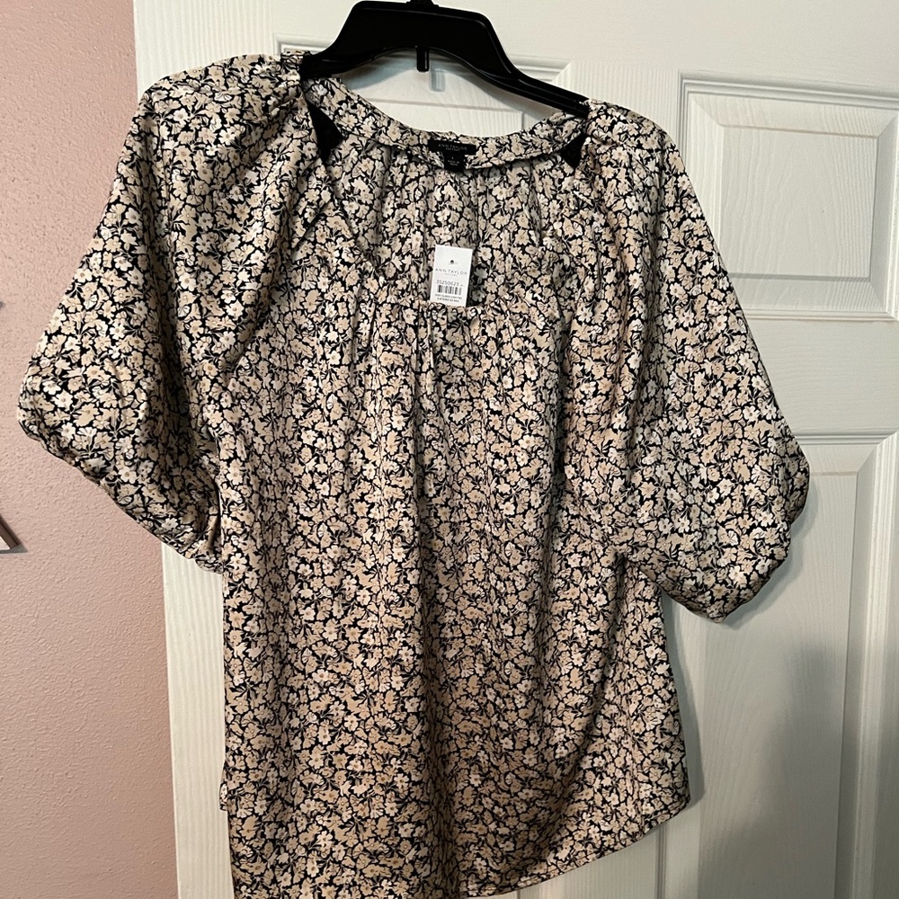 And Taylor brand new blouse with tags. Size large.